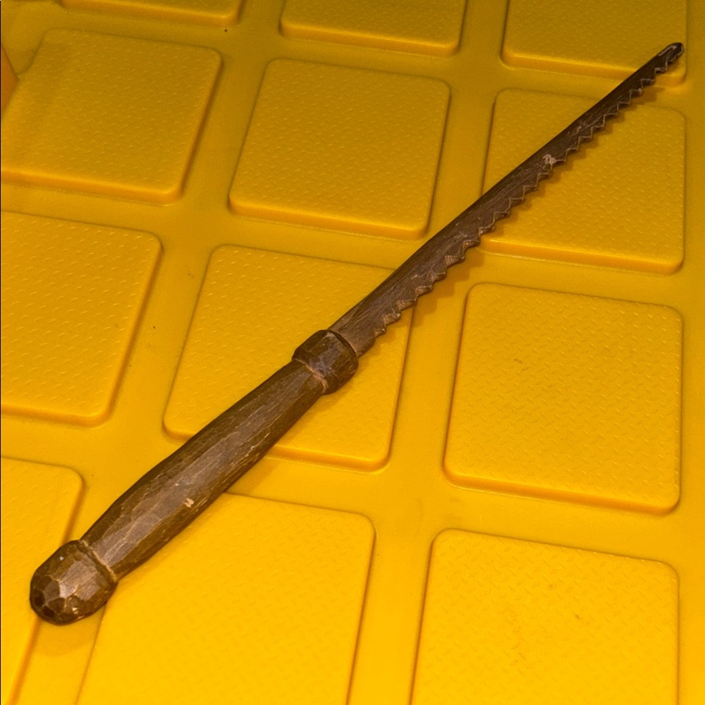 Vintage hand carved serrated letter opener